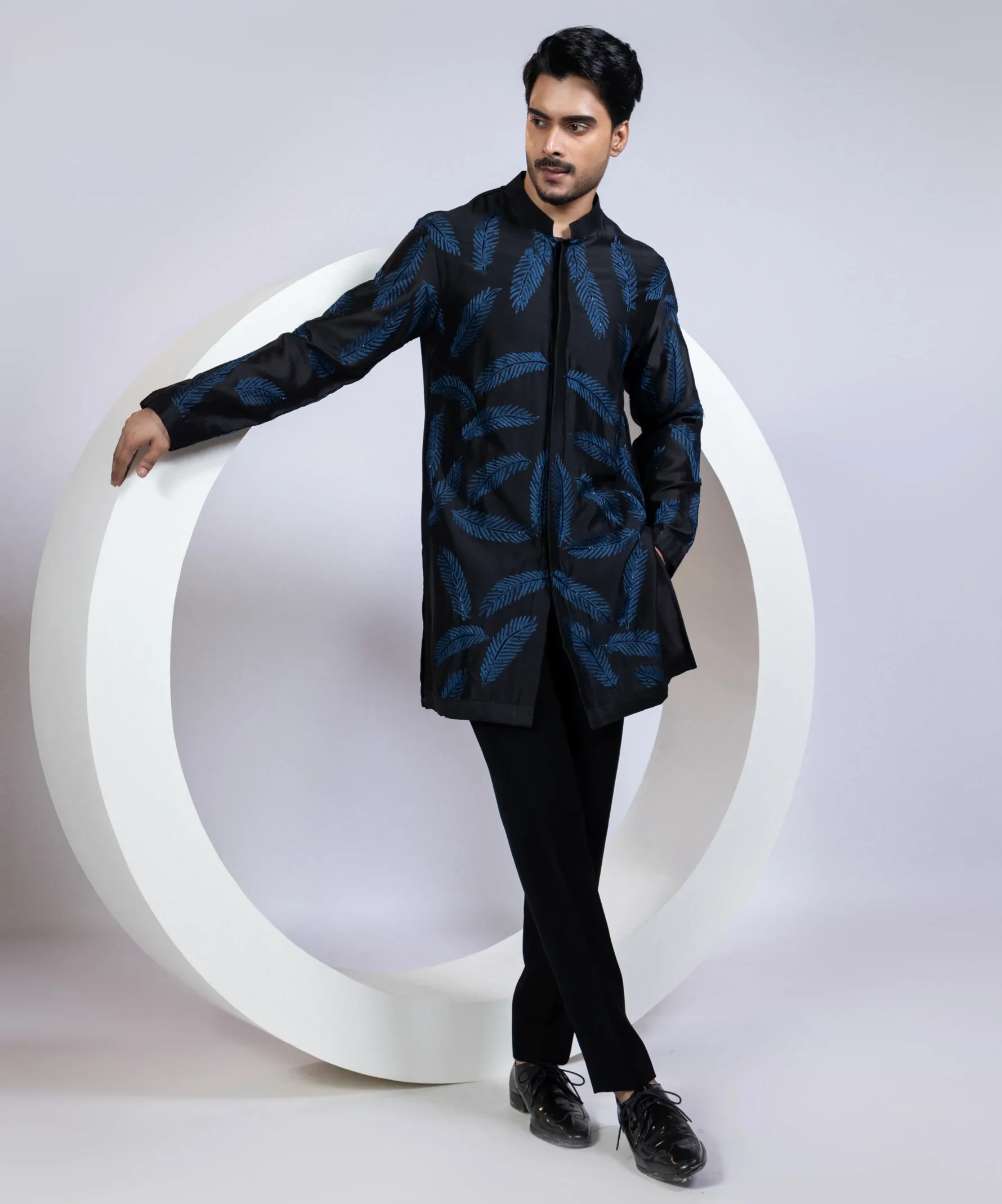 Black kurta set with indigo fern leaf embroidery and cutdana work from Golden Muslin By Anuj Agarwal