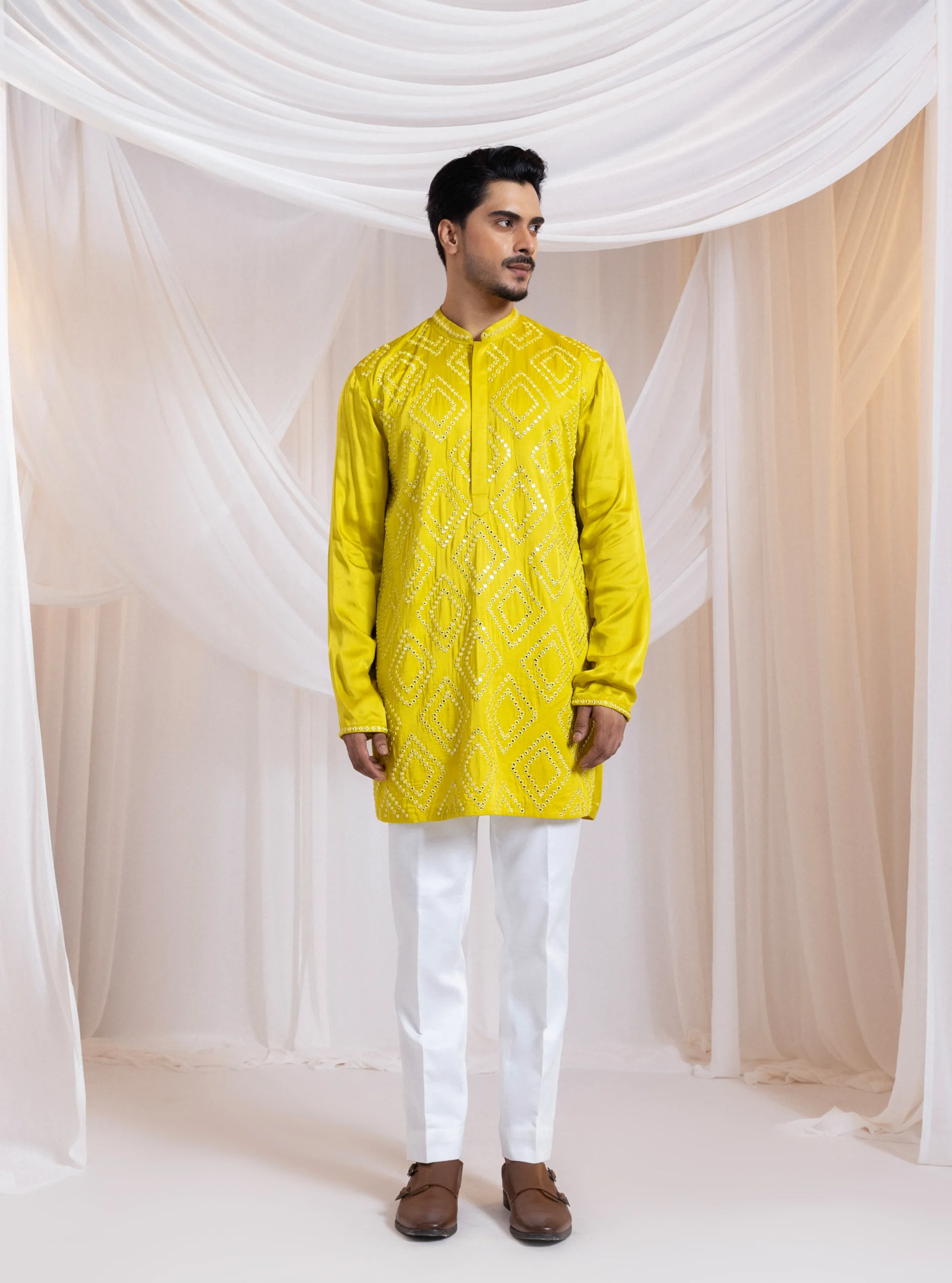 Yellow two-piece kurta set with geometric diamond mirrorwork embroidery from Golden Muslin By Anuj Agarwal