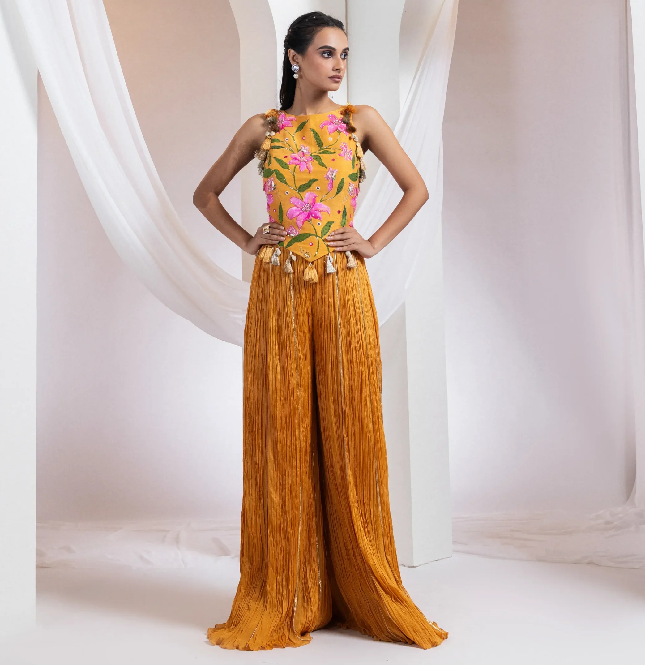Hand-painted floral corset with flared ruched pants in rust tangerine from Golden Muslin By Anuj Agarwal