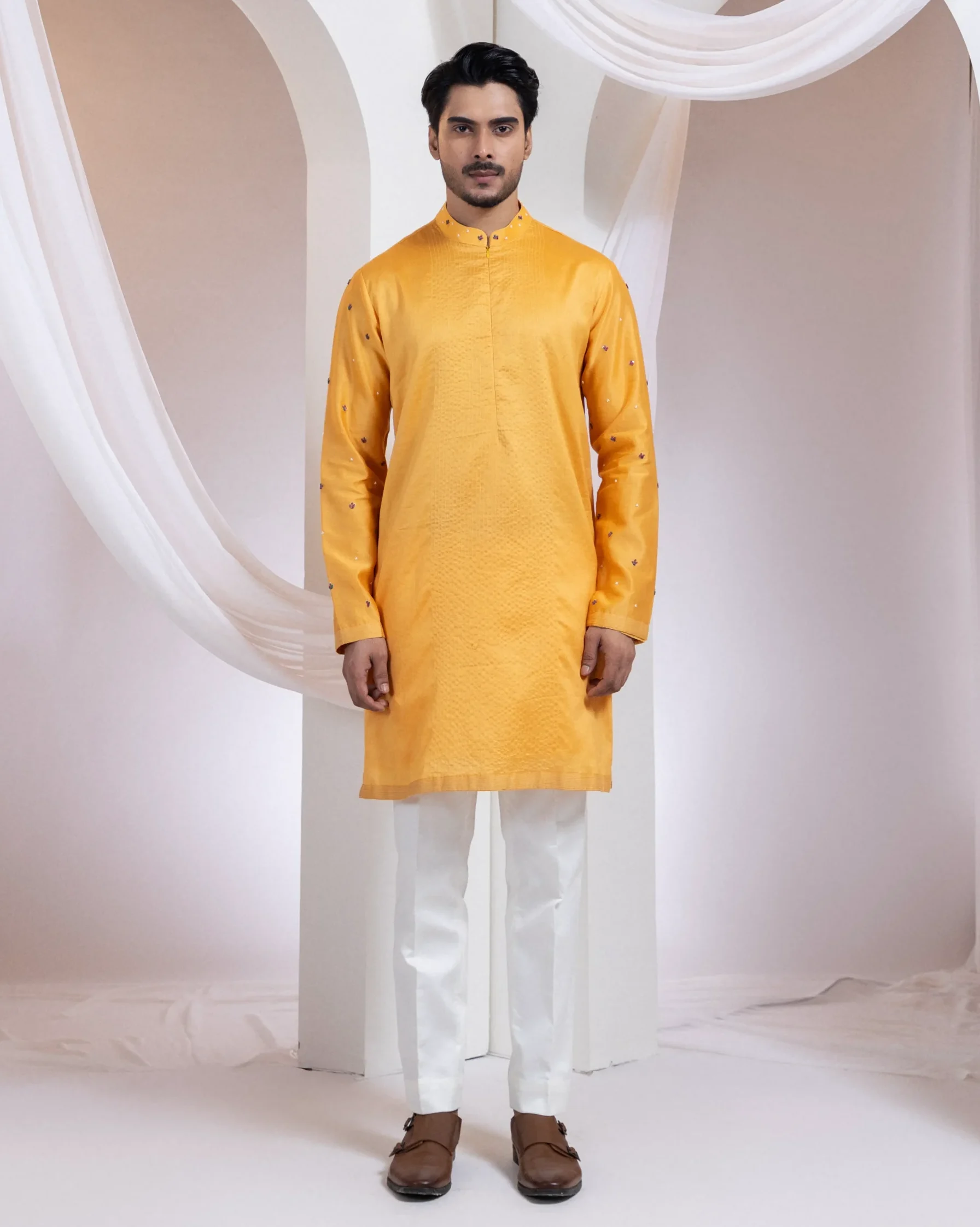 Mustard yellow textured straight kurta set with bead detailing from Golden Muslin By Anuj Agarwal