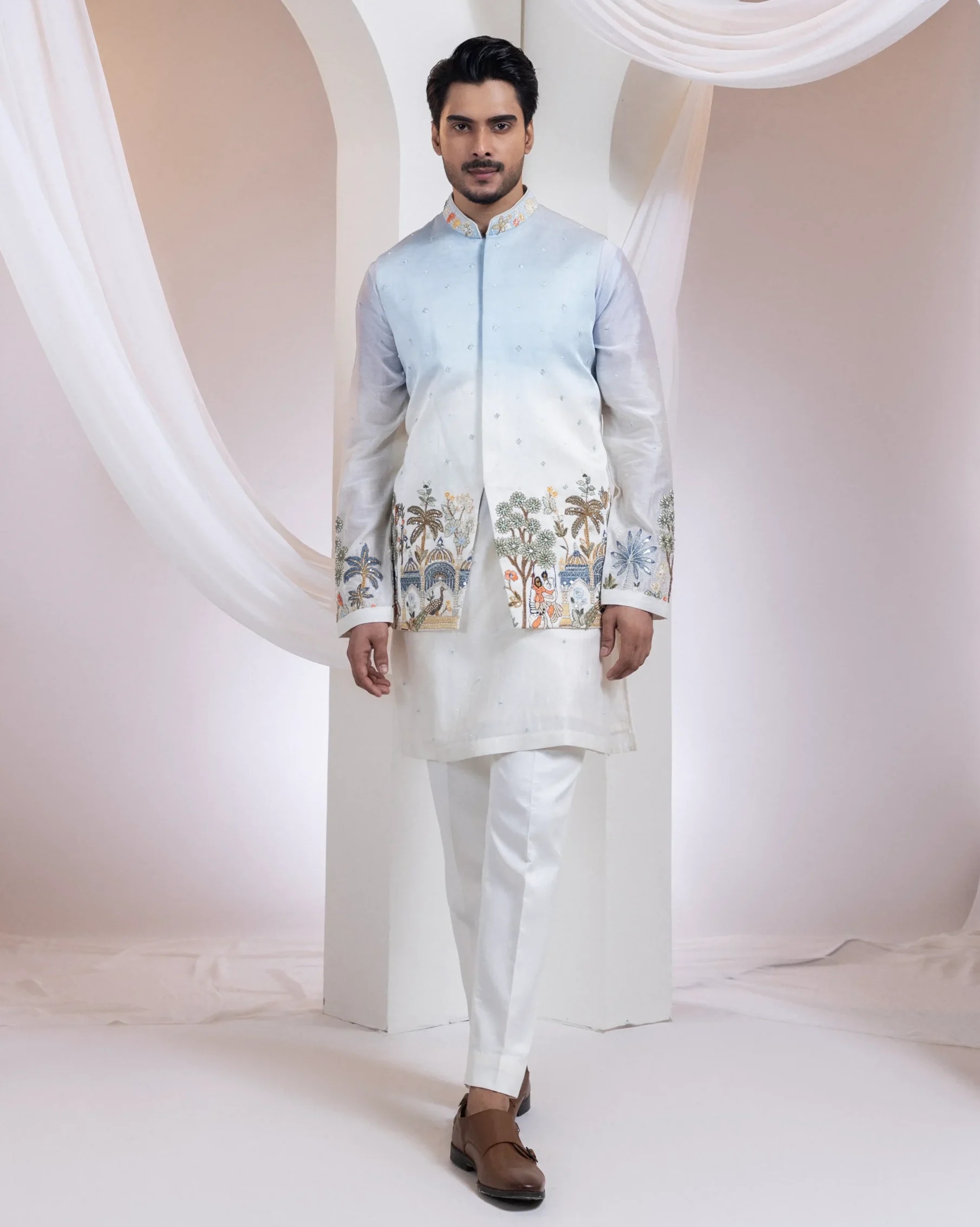 Powder blue ombre Nehru jacket kurta set with Madhubani embroidery from Golden Muslin By Anuj Agarwal
