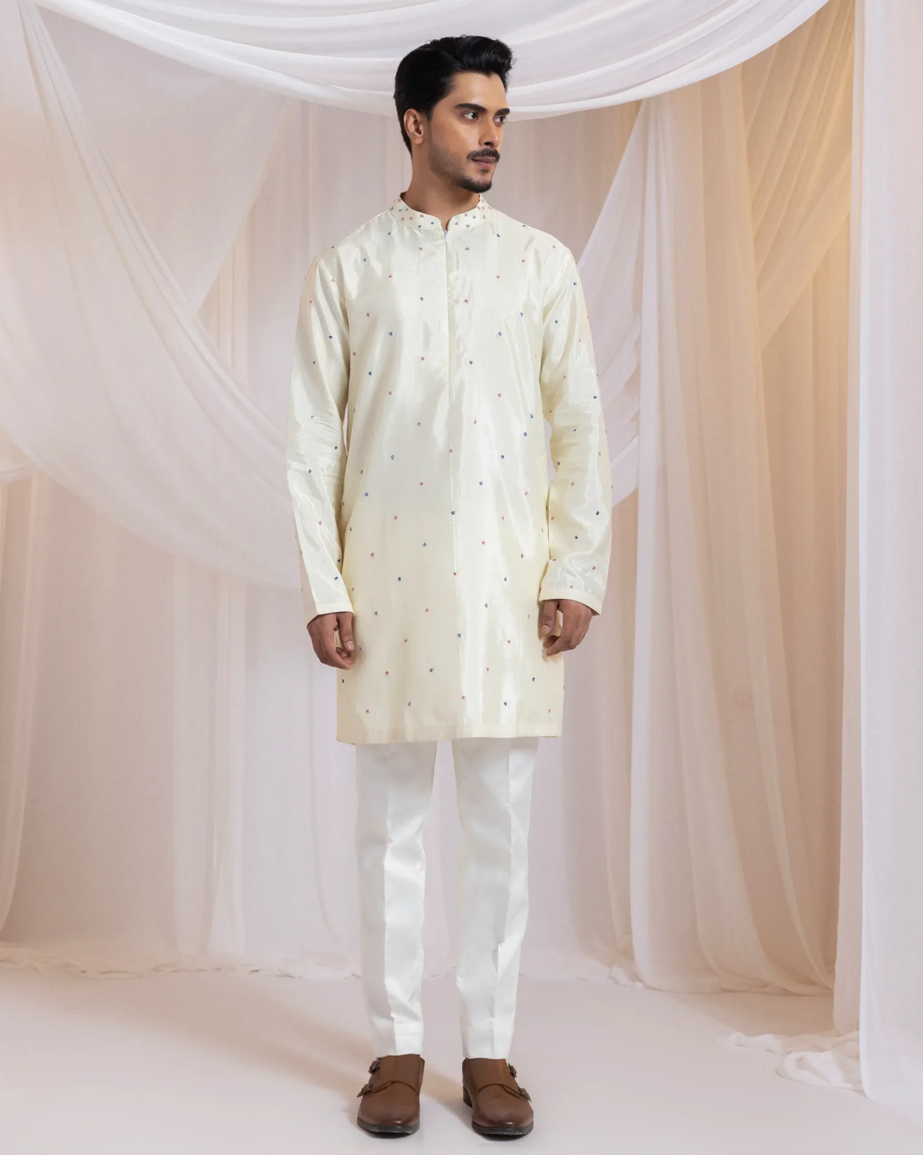 Ivory kurta set with blue and pink French knot embroidery from Golden Muslin By Anuj Agarwal