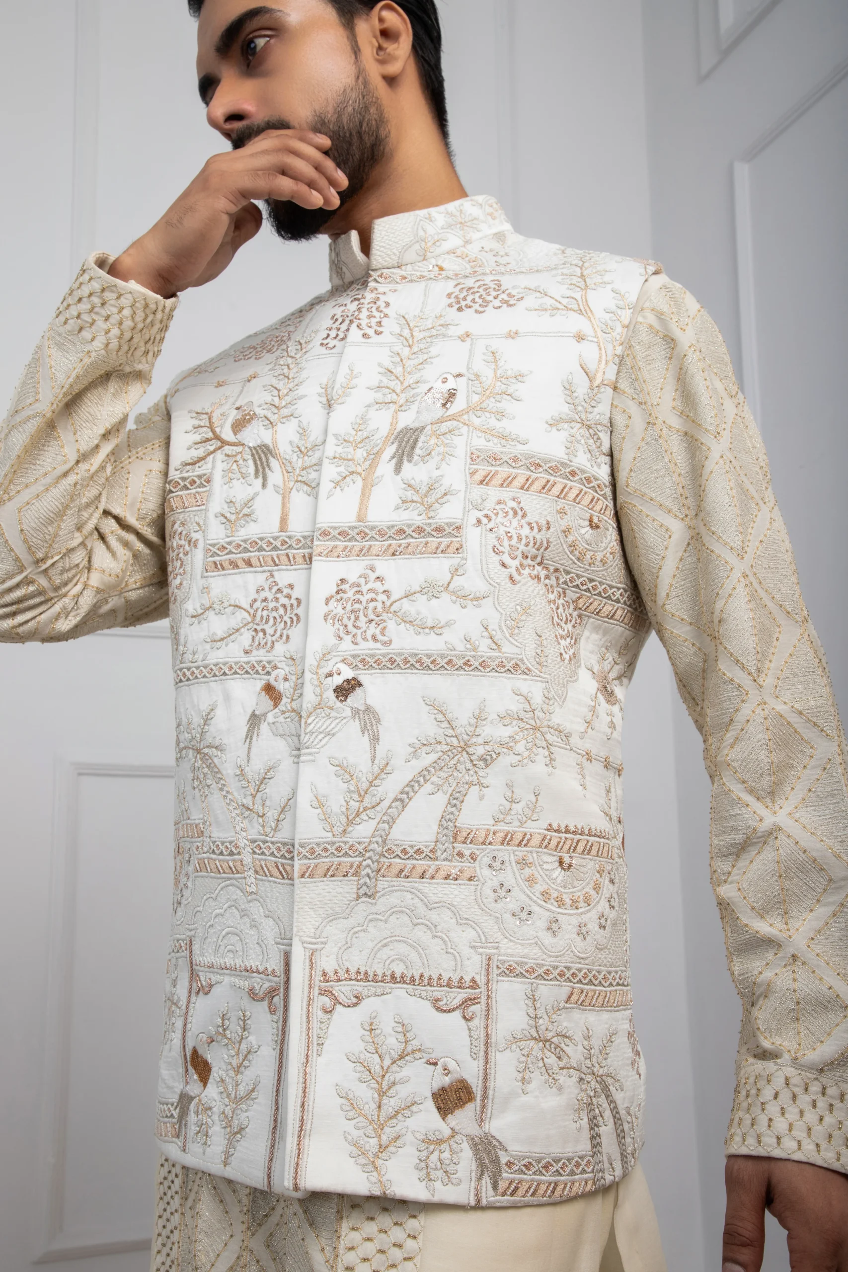 Model wearing gilded ivory golden muslin Nehru jacket with tonal embroidery and mandarin collar