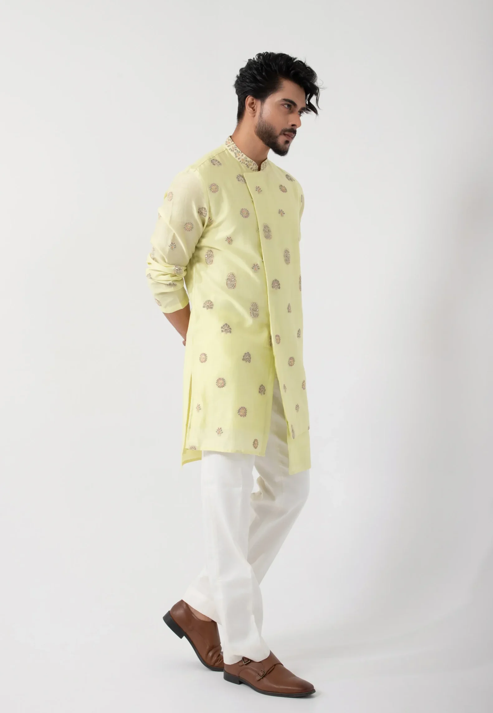 Lemon-yellow silk mulmul kurta set with floral motifs and layered hem by Golden Muslin
