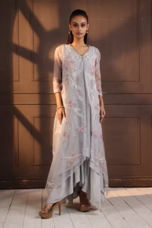 Model wearing grey golden muslin asymmetrical hand embroidered tunic set with floral vine detailing