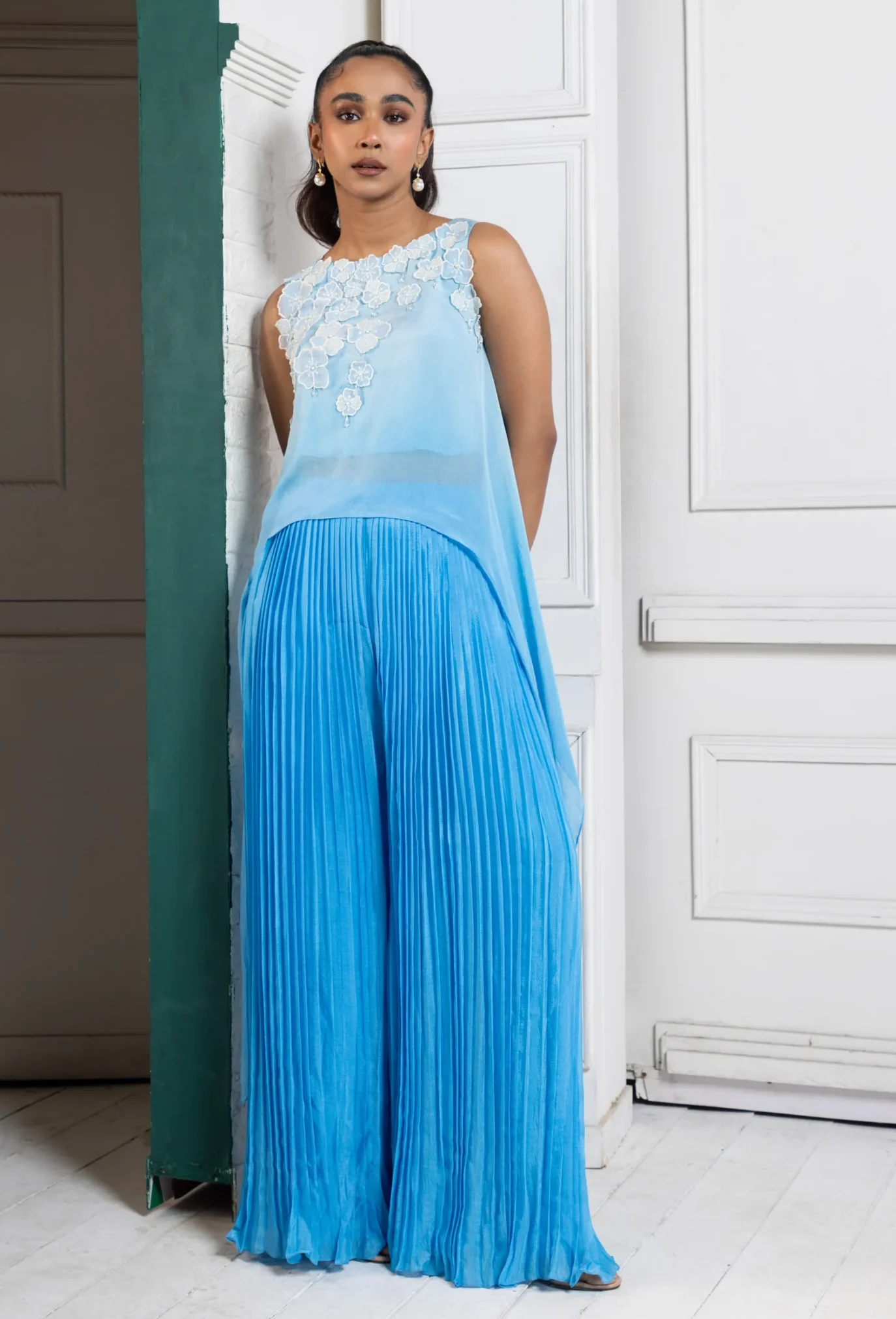 Sky blue asymmetric chiffon set with floral applique bodice and pleated cascade pants from Golden Muslin By Anuj Agarwal