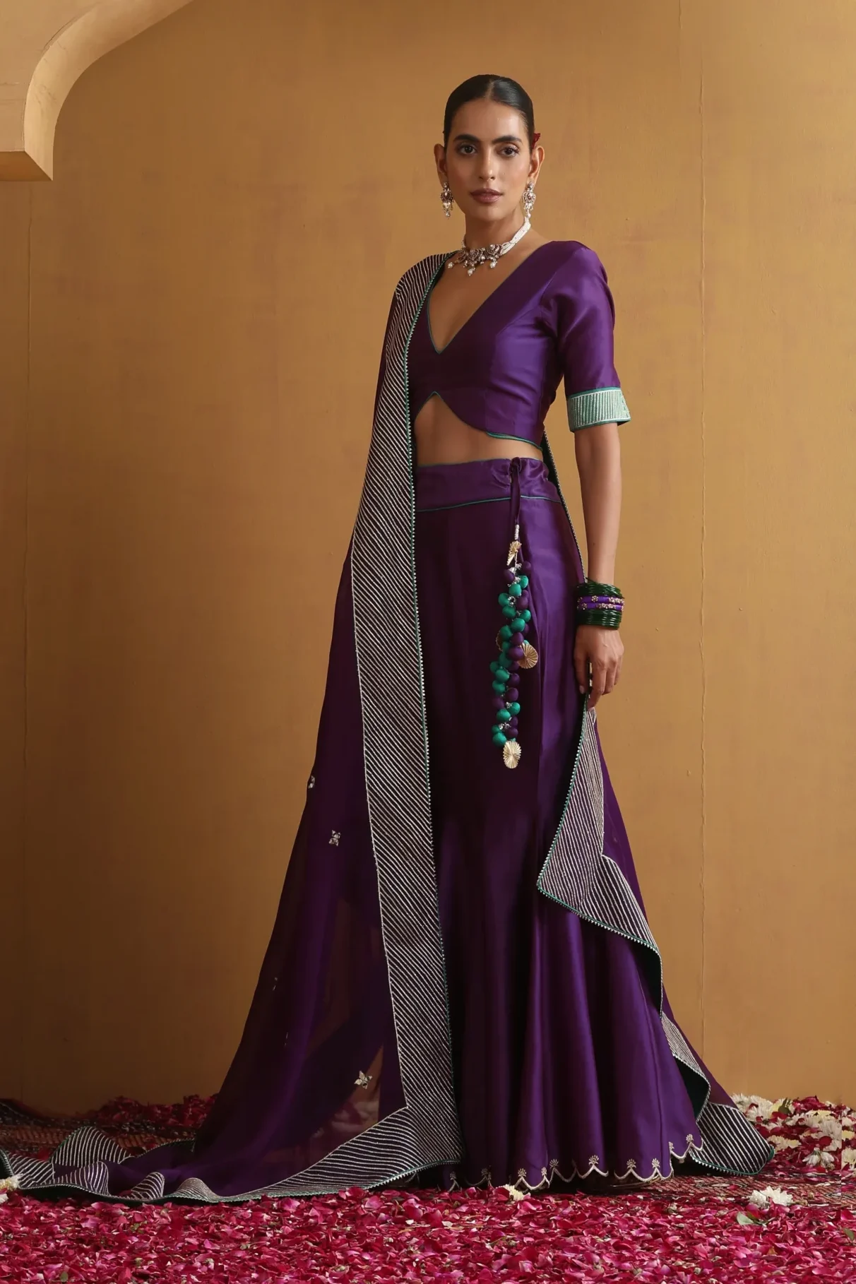Deep purple lehenga set with silver scalloped zari border and embroidered blouse from Golden Muslin By Suikala