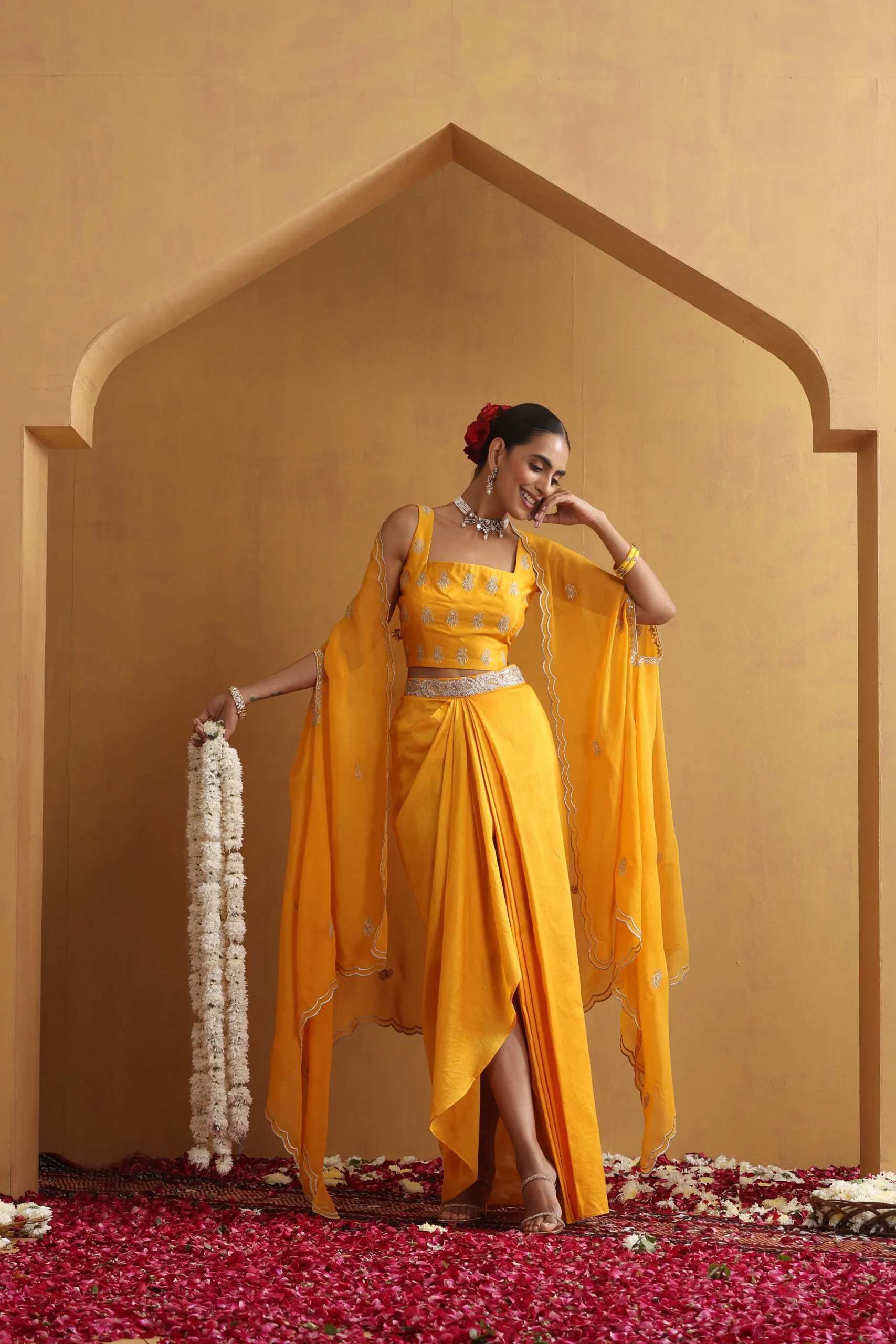 Radiant yellow draped embroidered ensemble with cape sleeves from Golden Muslin By Suikala
