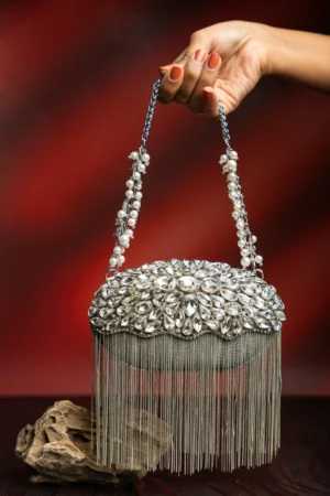 Diamond Hinted Radiance Silver Crystal Clutch with Metallic Fringe Handle