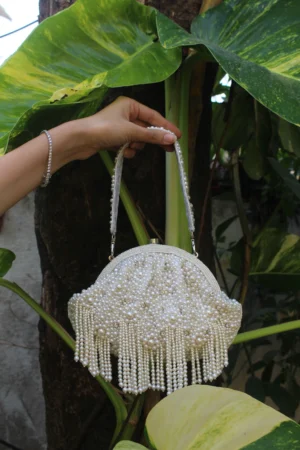 Light Gold Sequinned Potli with Pearl Tassels and Elegant Drawstring Detail