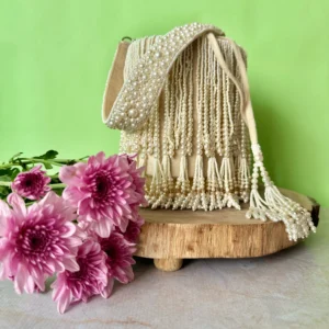 Off White Pearl Tassel Potli with Decorative Lock and Elegant Finish