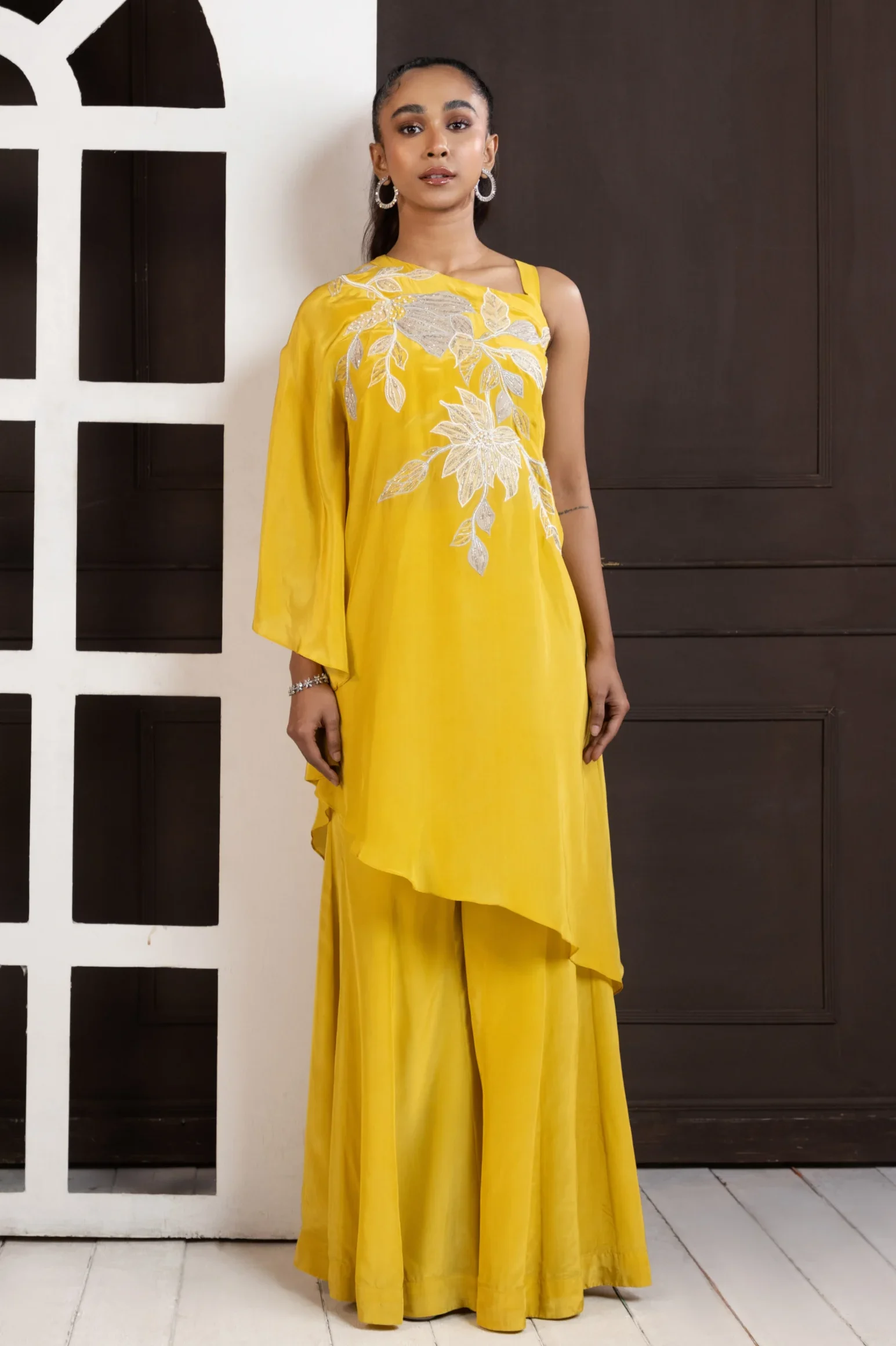 Mustard Yellow Asymmetrical Palazzo Set with silver floral embroidery from Golden Muslin By Anuj Agarwal