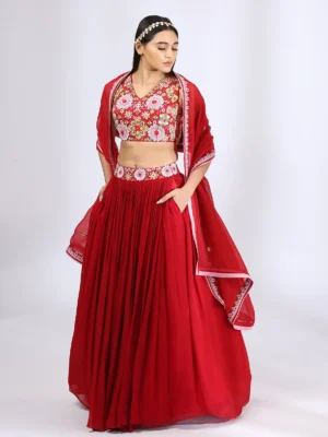 Bright Red embroidered choli teamed with a pleated lehenga and dupatta