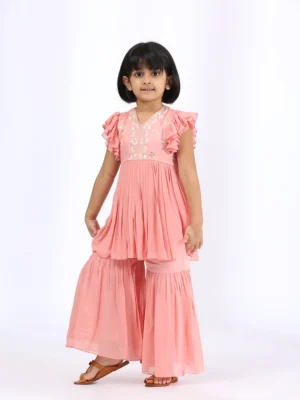 Peach Embroidered Peplum teamed with gharara pants