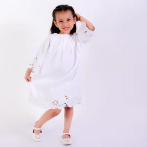 Ivory pleated dress with cutwork embroidered border on hemline and sleeve
