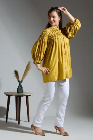 Mustard top with smocking detail on the yoke