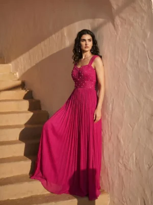 Magenta Pearl Embellished Pleated Chinon Gown from Golden Muslin By Anjali Design Studio with sweetheart neckline and flowing skirt
