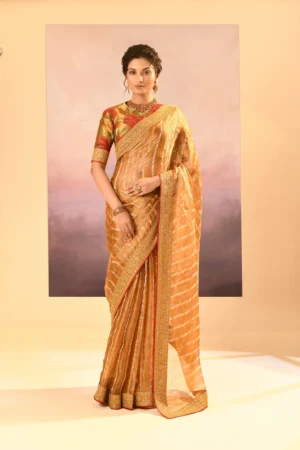 Golden Tissue Saree with Embroidered Borders & Floral Blouse